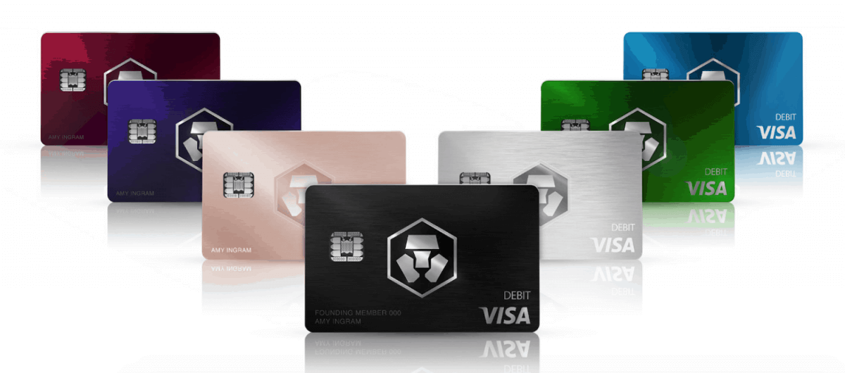 Crypto.com visa debit cards in different colours sitting in a staggered line